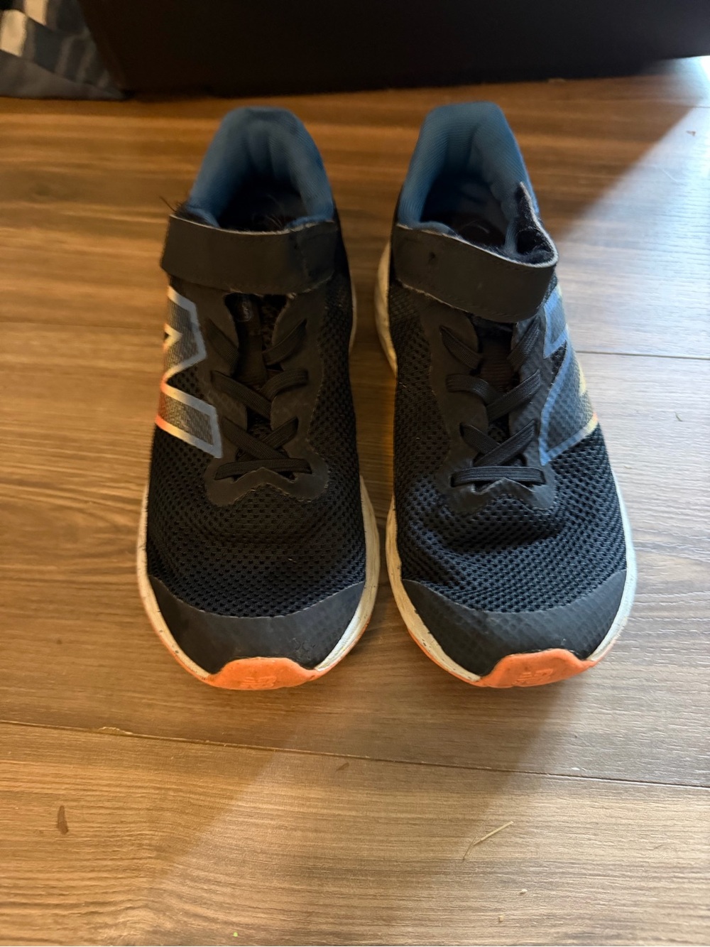 Kids Black Athletic Sneakers with Orange Accents